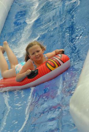 Ilminster Town FC fun day Part 28 – July 9, 2016: A giant water slide was the star attraction at a family fun day held to celebrate Ilminster Town Football Club’s new Archie Gooch Pavilion headquarters in Britten’s Field. Photo 3