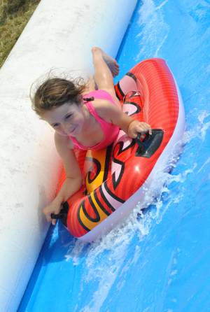 Ilminster Town FC fun day Part 28 – July 9, 2016: A giant water slide was the star attraction at a family fun day held to celebrate Ilminster Town Football Club’s new Archie Gooch Pavilion headquarters in Britten’s Field. Photo 6