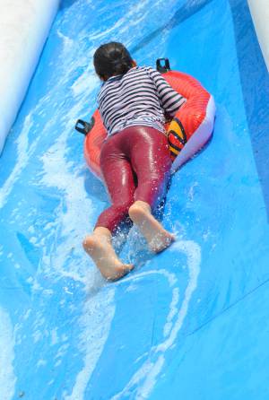 Ilminster Town FC fun day Part 28 – July 9, 2016: A giant water slide was the star attraction at a family fun day held to celebrate Ilminster Town Football Club’s new Archie Gooch Pavilion headquarters in Britten’s Field. Photo 7