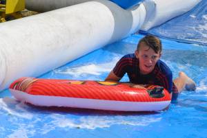 Ilminster Town FC fun day Part 28 – July 9, 2016: A giant water slide was the star attraction at a family fun day held to celebrate Ilminster Town Football Club’s new Archie Gooch Pavilion headquarters in Britten’s Field. Photo 8