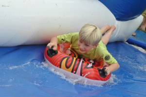 Ilminster Town FC fun day Part 29 – July 9, 2016: A giant water slide was the star attraction at a family fun day held to celebrate Ilminster Town Football Club’s new Archie Gooch Pavilion headquarters in Britten’s Field. Photo 13
