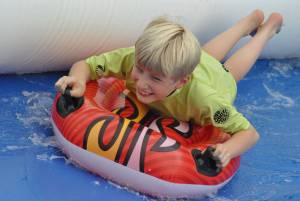 Ilminster Town FC fun day Part 29 – July 9, 2016: A giant water slide was the star attraction at a family fun day held to celebrate Ilminster Town Football Club’s new Archie Gooch Pavilion headquarters in Britten’s Field. Photo 14