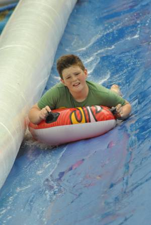 Ilminster Town FC fun day Part 29 – July 9, 2016: A giant water slide was the star attraction at a family fun day held to celebrate Ilminster Town Football Club’s new Archie Gooch Pavilion headquarters in Britten’s Field. Photo 15