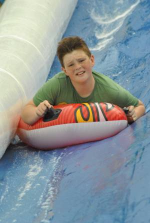 Ilminster Town FC fun day Part 29 – July 9, 2016: A giant water slide was the star attraction at a family fun day held to celebrate Ilminster Town Football Club’s new Archie Gooch Pavilion headquarters in Britten’s Field. Photo 16
