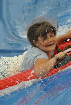 Ilminster Town FC fun day Part 29 – July 9, 2016: A giant water slide was the star attraction at a family fun day held to celebrate Ilminster Town Football Club’s new Archie Gooch Pavilion headquarters in Britten’s Field. Photo 18