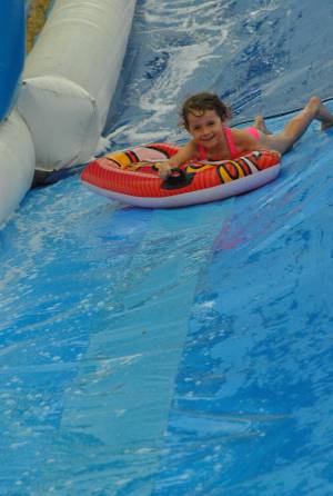 Ilminster Town FC fun day Part 29 – July 9, 2016: A giant water slide was the star attraction at a family fun day held to celebrate Ilminster Town Football Club’s new Archie Gooch Pavilion headquarters in Britten’s Field. Photo 19