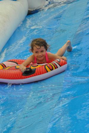 Ilminster Town FC fun day Part 29 – July 9, 2016: A giant water slide was the star attraction at a family fun day held to celebrate Ilminster Town Football Club’s new Archie Gooch Pavilion headquarters in Britten’s Field. Photo 20