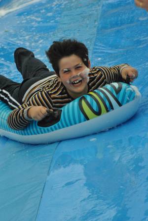 Ilminster Town FC fun day Part 29 – July 9, 2016: A giant water slide was the star attraction at a family fun day held to celebrate Ilminster Town Football Club’s new Archie Gooch Pavilion headquarters in Britten’s Field. Photo 21