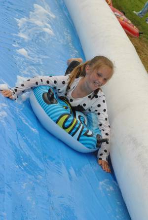 Ilminster Town FC fun day Part 29 – July 9, 2016: A giant water slide was the star attraction at a family fun day held to celebrate Ilminster Town Football Club’s new Archie Gooch Pavilion headquarters in Britten’s Field. Photo 24