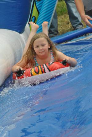 Ilminster Town FC fun day Part 29 – July 9, 2016: A giant water slide was the star attraction at a family fun day held to celebrate Ilminster Town Football Club’s new Archie Gooch Pavilion headquarters in Britten’s Field. Photo 2