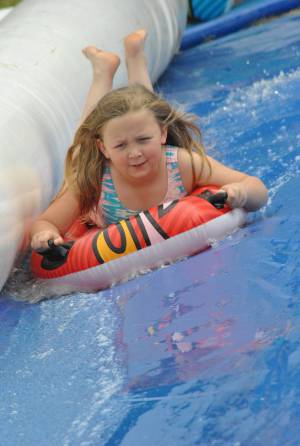Ilminster Town FC fun day Part 29 – July 9, 2016: A giant water slide was the star attraction at a family fun day held to celebrate Ilminster Town Football Club’s new Archie Gooch Pavilion headquarters in Britten’s Field. Photo 3