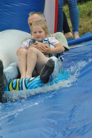 Ilminster Town FC fun day Part 29 – July 9, 2016: A giant water slide was the star attraction at a family fun day held to celebrate Ilminster Town Football Club’s new Archie Gooch Pavilion headquarters in Britten’s Field. Photo 4