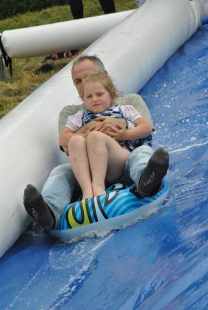 Ilminster Town FC fun day Part 29 – July 9, 2016: A giant water slide was the star attraction at a family fun day held to celebrate Ilminster Town Football Club’s new Archie Gooch Pavilion headquarters in Britten’s Field. Photo 5