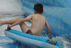 Ilminster Town FC fun day Part 30 – July 9, 2016: A giant water slide was the star attraction at a family fun day held to celebrate Ilminster Town Football Club’s new Archie Gooch Pavilion headquarters in Britten’s Field. Photo 11