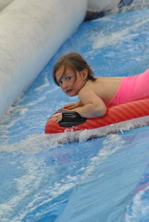 Ilminster Town FC fun day Part 30 – July 9, 2016: A giant water slide was the star attraction at a family fun day held to celebrate Ilminster Town Football Club’s new Archie Gooch Pavilion headquarters in Britten’s Field. Photo 12