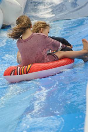 Ilminster Town FC fun day Part 30 – July 9, 2016: A giant water slide was the star attraction at a family fun day held to celebrate Ilminster Town Football Club’s new Archie Gooch Pavilion headquarters in Britten’s Field. Photo 13