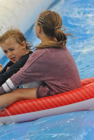 Ilminster Town FC fun day Part 30 – July 9, 2016: A giant water slide was the star attraction at a family fun day held to celebrate Ilminster Town Football Club’s new Archie Gooch Pavilion headquarters in Britten’s Field. Photo 14