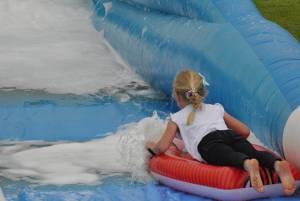 Ilminster Town FC fun day Part 30 – July 9, 2016: A giant water slide was the star attraction at a family fun day held to celebrate Ilminster Town Football Club’s new Archie Gooch Pavilion headquarters in Britten’s Field. Photo 15