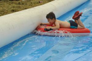 Ilminster Town FC fun day Part 30 – July 9, 2016: A giant water slide was the star attraction at a family fun day held to celebrate Ilminster Town Football Club’s new Archie Gooch Pavilion headquarters in Britten’s Field. Photo 18