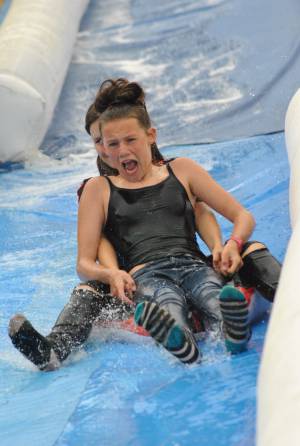 Ilminster Town FC fun day Part 30 – July 9, 2016: A giant water slide was the star attraction at a family fun day held to celebrate Ilminster Town Football Club’s new Archie Gooch Pavilion headquarters in Britten’s Field. Photo 20