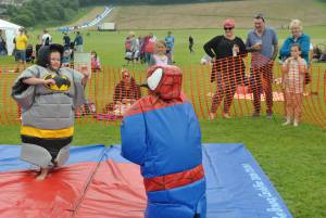 Ilminster Town FC fun day Part 30 – July 9, 2016: A giant water slide was the star attraction at a family fun day held to celebrate Ilminster Town Football Club’s new Archie Gooch Pavilion headquarters in Britten’s Field. Photo 5