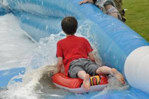 Ilminster Town FC fun day Part 30 – July 9, 2016: A giant water slide was the star attraction at a family fun day held to celebrate Ilminster Town Football Club’s new Archie Gooch Pavilion headquarters in Britten’s Field. Photo 8