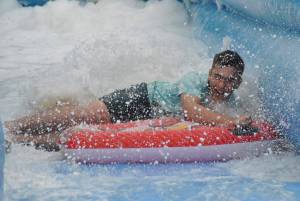 Ilminster Town FC fun day Part 31 – July 9, 2016: A giant water slide was the star attraction at a family fun day held to celebrate Ilminster Town Football Club’s new Archie Gooch Pavilion headquarters in Britten’s Field. Photo 12