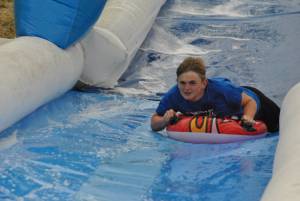 Ilminster Town FC fun day Part 31 – July 9, 2016: A giant water slide was the star attraction at a family fun day held to celebrate Ilminster Town Football Club’s new Archie Gooch Pavilion headquarters in Britten’s Field. Photo 13