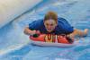 Ilminster Town FC fun day Part 31 – July 9, 2016: A giant water slide was the star attraction at a family fun day held to celebrate Ilminster Town Football Club’s new Archie Gooch Pavilion headquarters in Britten’s Field. Photo 14