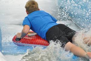 Ilminster Town FC fun day Part 31 – July 9, 2016: A giant water slide was the star attraction at a family fun day held to celebrate Ilminster Town Football Club’s new Archie Gooch Pavilion headquarters in Britten’s Field. Photo 15