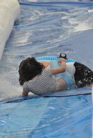 Ilminster Town FC fun day Part 31 – July 9, 2016: A giant water slide was the star attraction at a family fun day held to celebrate Ilminster Town Football Club’s new Archie Gooch Pavilion headquarters in Britten’s Field. Photo 1