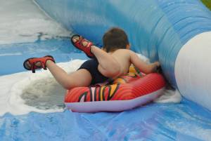 Ilminster Town FC fun day Part 31 – July 9, 2016: A giant water slide was the star attraction at a family fun day held to celebrate Ilminster Town Football Club’s new Archie Gooch Pavilion headquarters in Britten’s Field. Photo 18