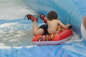 Ilminster Town FC fun day Part 31 – July 9, 2016: A giant water slide was the star attraction at a family fun day held to celebrate Ilminster Town Football Club’s new Archie Gooch Pavilion headquarters in Britten’s Field. Photo 19