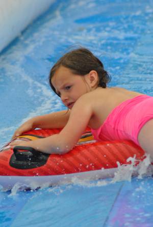 Ilminster Town FC fun day Part 31 – July 9, 2016: A giant water slide was the star attraction at a family fun day held to celebrate Ilminster Town Football Club’s new Archie Gooch Pavilion headquarters in Britten’s Field. Photo 20