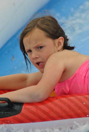 Ilminster Town FC fun day Part 31 – July 9, 2016: A giant water slide was the star attraction at a family fun day held to celebrate Ilminster Town Football Club’s new Archie Gooch Pavilion headquarters in Britten’s Field. Photo 21
