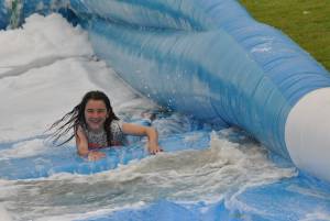 Ilminster Town FC fun day Part 31 – July 9, 2016: A giant water slide was the star attraction at a family fun day held to celebrate Ilminster Town Football Club’s new Archie Gooch Pavilion headquarters in Britten’s Field. Photo 3