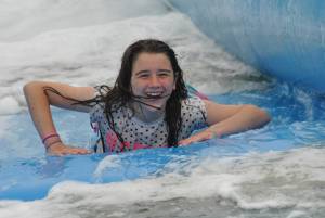 Ilminster Town FC fun day Part 31 – July 9, 2016: A giant water slide was the star attraction at a family fun day held to celebrate Ilminster Town Football Club’s new Archie Gooch Pavilion headquarters in Britten’s Field. Photo 4