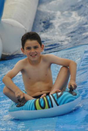 Ilminster Town FC fun day Part 31 – July 9, 2016: A giant water slide was the star attraction at a family fun day held to celebrate Ilminster Town Football Club’s new Archie Gooch Pavilion headquarters in Britten’s Field. Photo 7