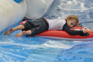 Ilminster Town FC fun day Part 31 – July 9, 2016: A giant water slide was the star attraction at a family fun day held to celebrate Ilminster Town Football Club’s new Archie Gooch Pavilion headquarters in Britten’s Field. Photo 8