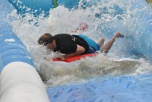 Ilminster Town FC fun day Part 32 – July 9, 2016: A giant water slide was the star attraction at a family fun day held to celebrate Ilminster Town Football Club’s new Archie Gooch Pavilion headquarters in Britten’s Field. Photo 12