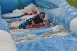 Ilminster Town FC fun day Part 32 – July 9, 2016: A giant water slide was the star attraction at a family fun day held to celebrate Ilminster Town Football Club’s new Archie Gooch Pavilion headquarters in Britten’s Field. Photo 13
