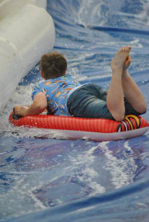 Ilminster Town FC fun day Part 32 – July 9, 2016: A giant water slide was the star attraction at a family fun day held to celebrate Ilminster Town Football Club’s new Archie Gooch Pavilion headquarters in Britten’s Field. Photo 14