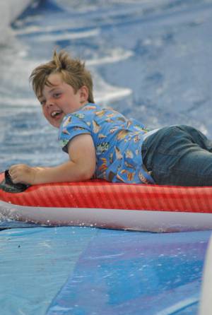 Ilminster Town FC fun day Part 32 – July 9, 2016: A giant water slide was the star attraction at a family fun day held to celebrate Ilminster Town Football Club’s new Archie Gooch Pavilion headquarters in Britten’s Field. Photo 15