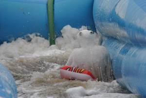Ilminster Town FC fun day Part 32 – July 9, 2016: A giant water slide was the star attraction at a family fun day held to celebrate Ilminster Town Football Club’s new Archie Gooch Pavilion headquarters in Britten’s Field. Photo 23