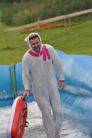 Ilminster Town FC fun day Part 32 – July 9, 2016: A giant water slide was the star attraction at a family fun day held to celebrate Ilminster Town Football Club’s new Archie Gooch Pavilion headquarters in Britten’s Field. Photo 24