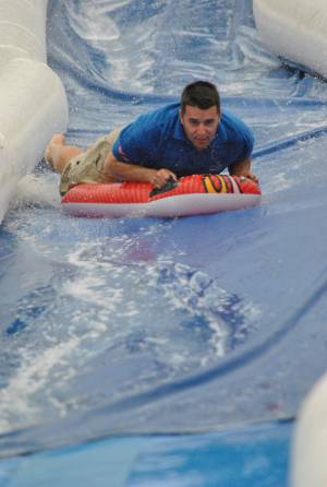 Ilminster Town FC fun day Part 32 – July 9, 2016: A giant water slide was the star attraction at a family fun day held to celebrate Ilminster Town Football Club’s new Archie Gooch Pavilion headquarters in Britten’s Field. Photo 25