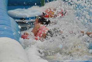 Ilminster Town FC fun day Part 32 – July 9, 2016: A giant water slide was the star attraction at a family fun day held to celebrate Ilminster Town Football Club’s new Archie Gooch Pavilion headquarters in Britten’s Field. Photo 8