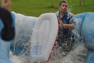 Ilminster Town FC fun day Part 33 – July 9, 2016: A giant water slide was the star attraction at a family fun day held to celebrate Ilminster Town Football Club’s new Archie Gooch Pavilion headquarters in Britten’s Field. Photo 1