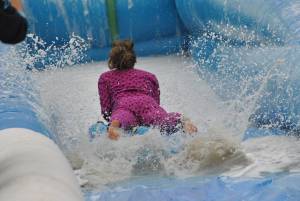 Ilminster Town FC fun day Part 33 – July 9, 2016: A giant water slide was the star attraction at a family fun day held to celebrate Ilminster Town Football Club’s new Archie Gooch Pavilion headquarters in Britten’s Field. Photo 19