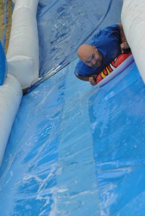 Ilminster Town FC fun day Part 33 – July 9, 2016: A giant water slide was the star attraction at a family fun day held to celebrate Ilminster Town Football Club’s new Archie Gooch Pavilion headquarters in Britten’s Field. Photo 23